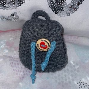 Tiny crochet keychain/pods holder .